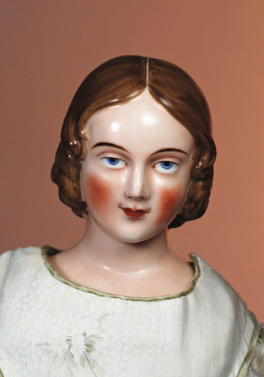 Rare brown-hair china portrait lady, circa 1850, 24 inches, fine modeling and finest quality porcelain. Estimate $6,000-$9,000. Image courtesy of Frasher’s Doll Auction.
